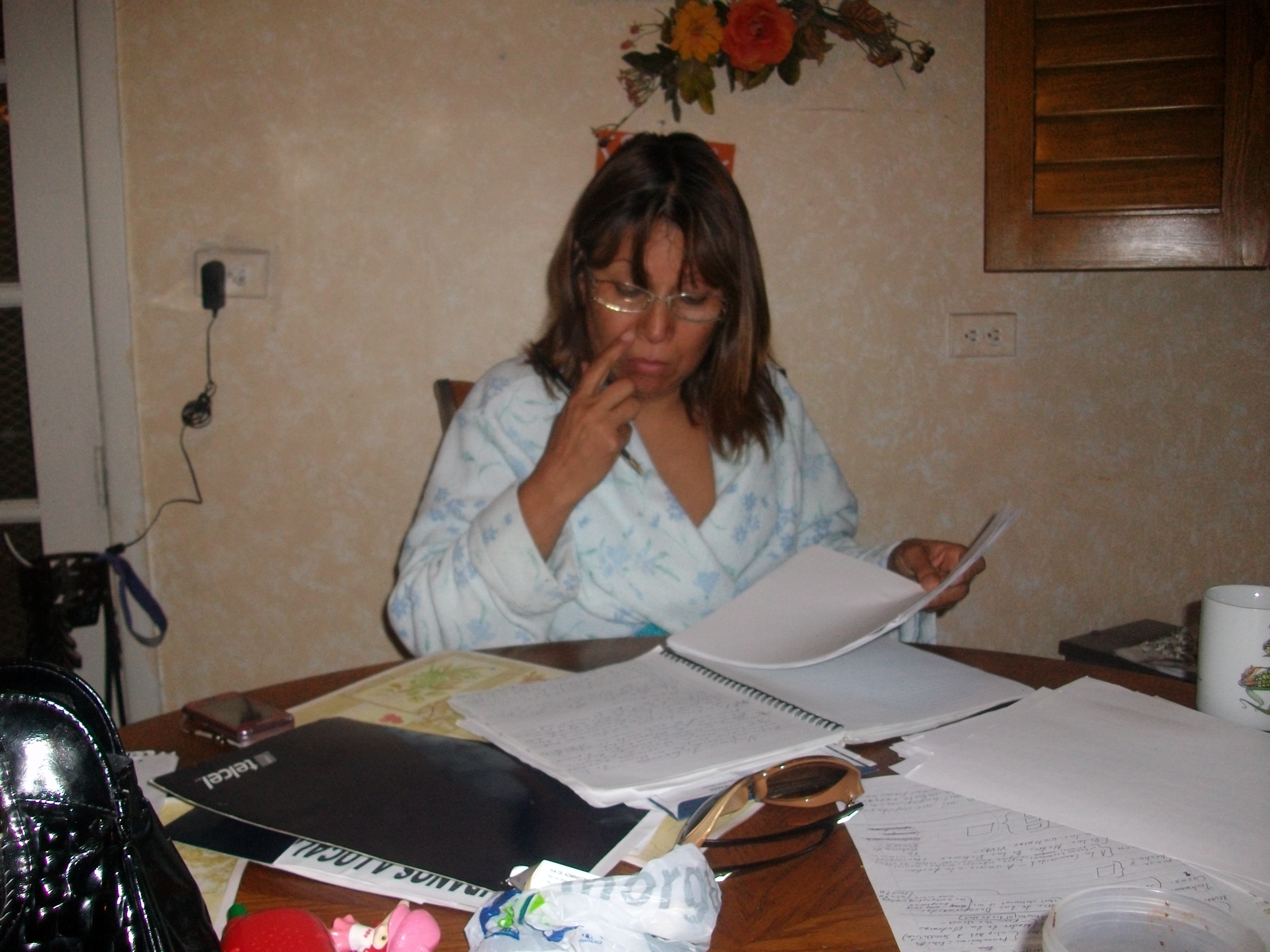 Marisela going through documents.