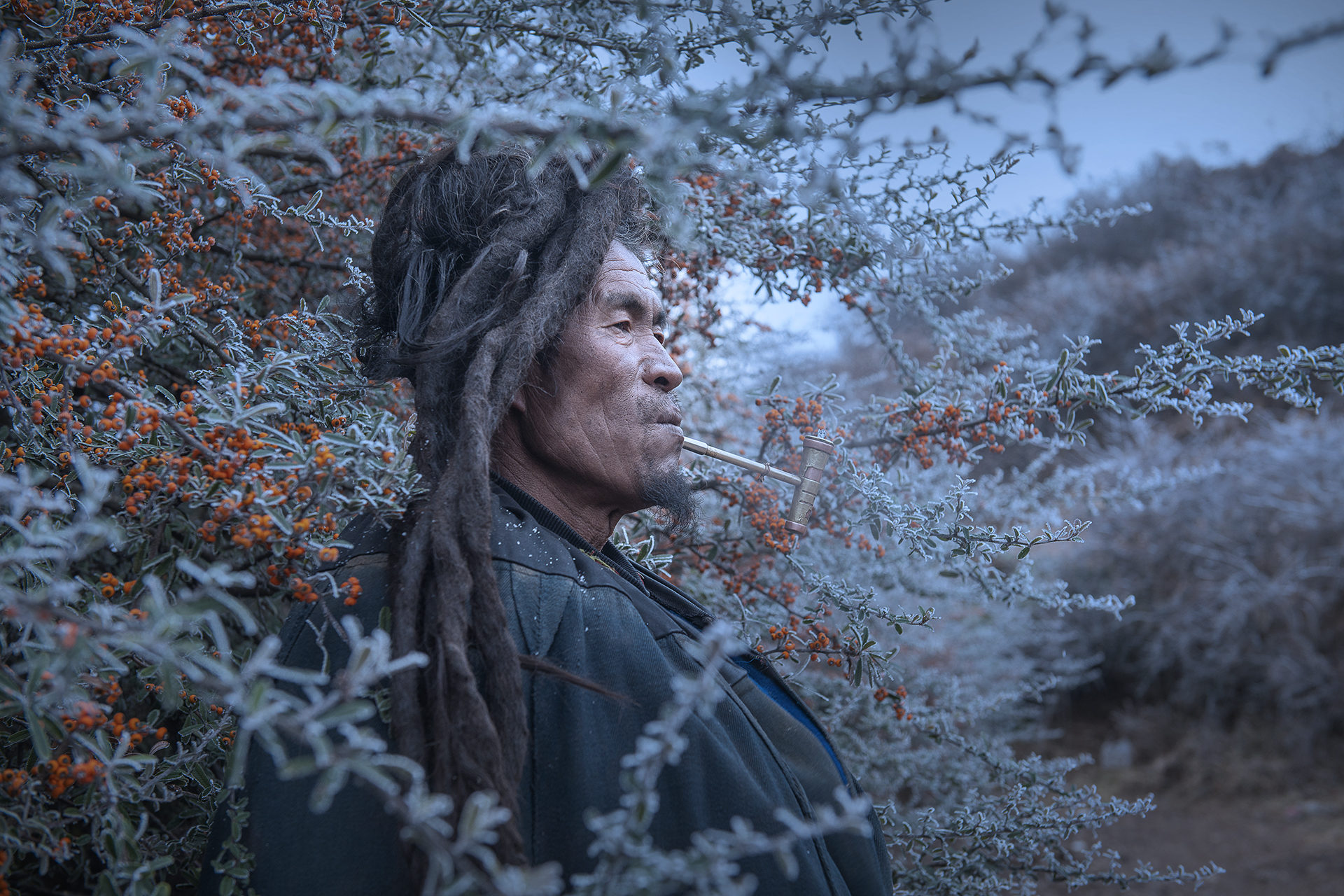 Yanrong Guo won the People category for her striking image Miss taken of a pipe-smoking man in Liangshan Yi Autonomous Prefecture, the largest settlement of ethnic minority Yi people in China. Photo: Yanrong Guo/Earth Photo 2020/RGS