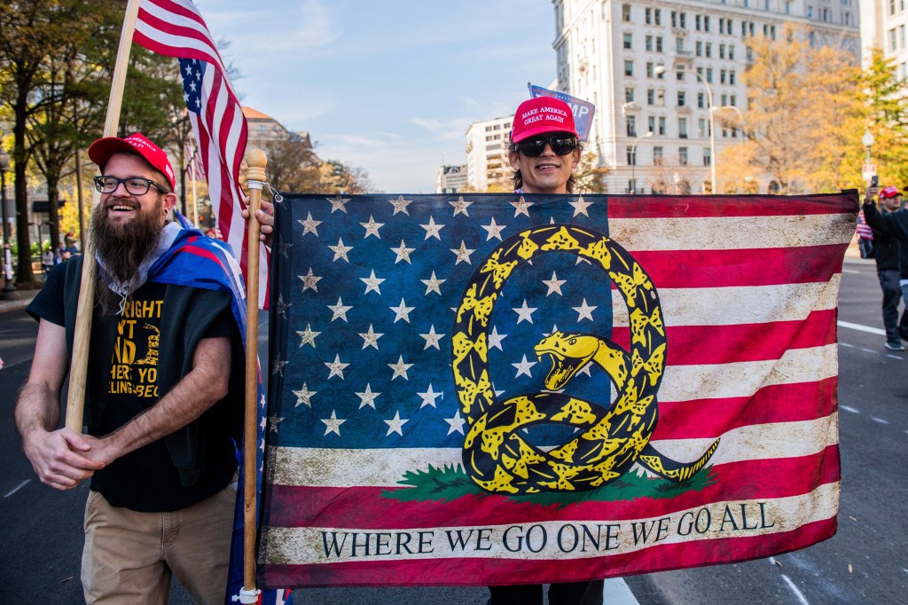 A Qanon supporter marches in route to the Supreme Court during the Million Maga March protest regarding election results on November 14, 2020 in Washington D.C. Photo: Chris Tuite/imageSPACE/MediaPunch /IPX​
