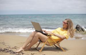 woman working beach workcation