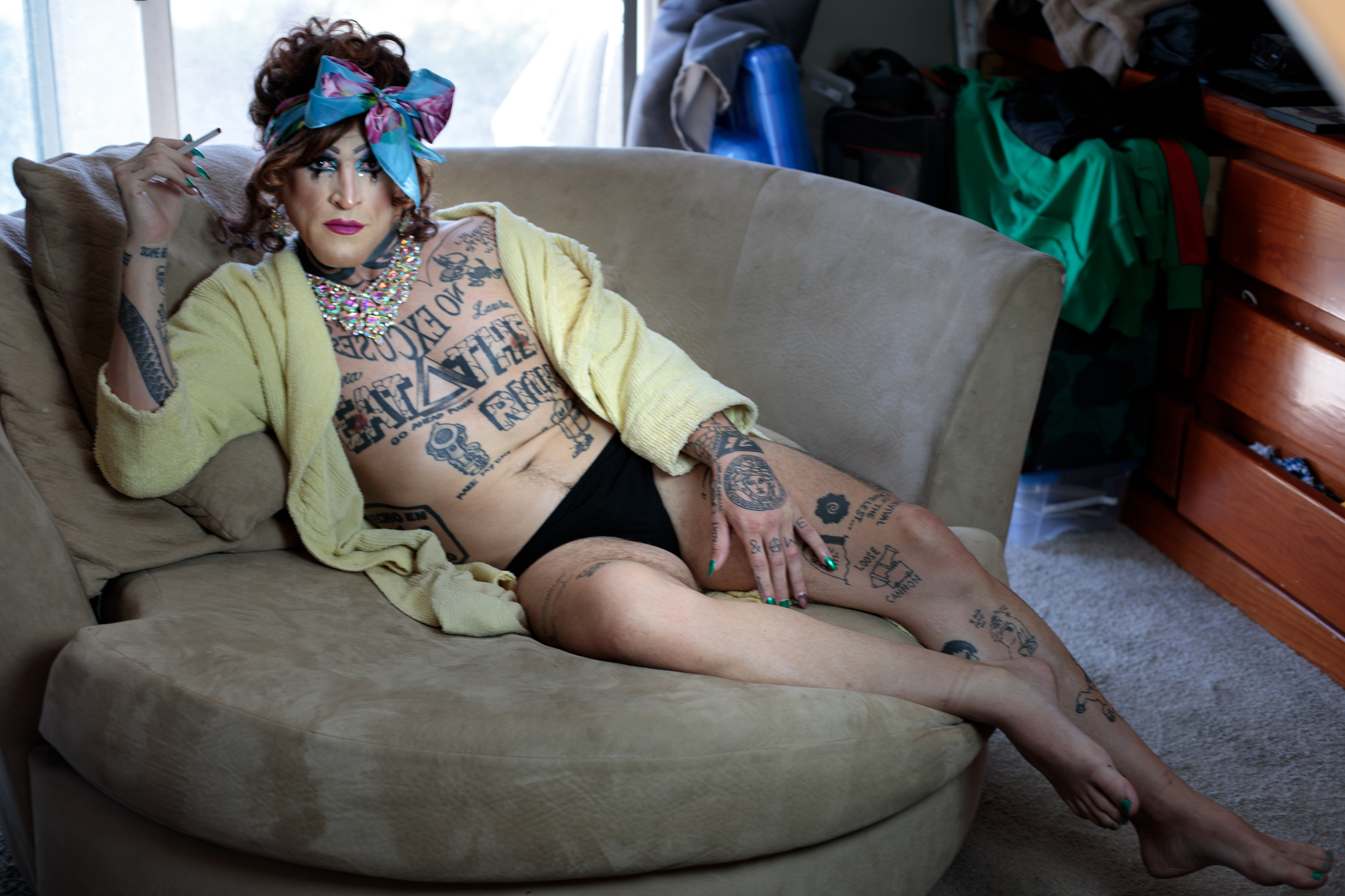 Photo of Garijo as Lola on the couch at home.