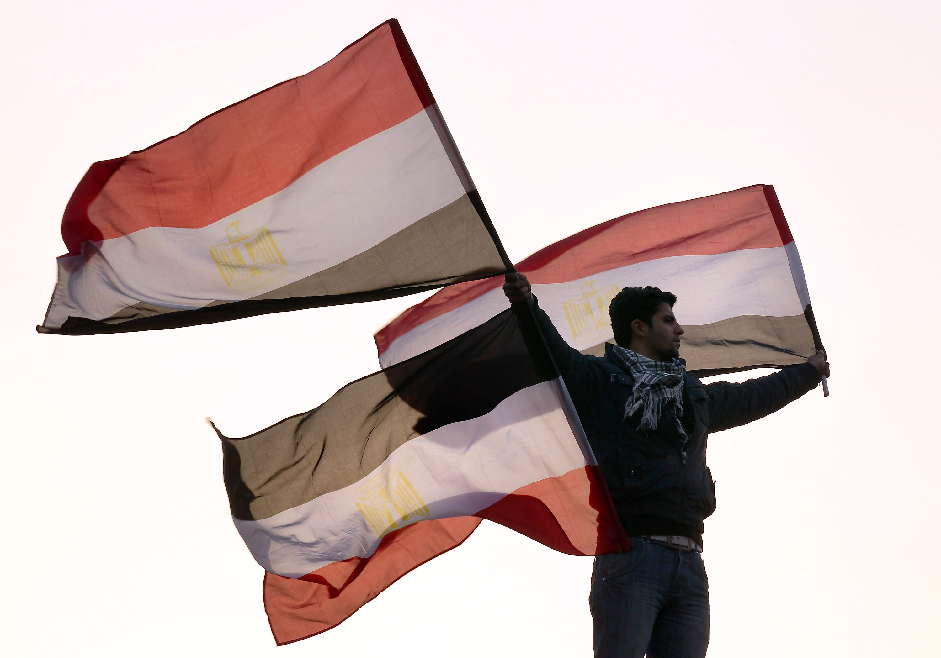 A protester waves Egyptian flags in Tahrir Square, in February 2011. Photo: Peter Macdiarmid/Getty Images