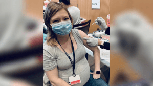 Emily Miller, a Columbia University doctor who specializes in infectious diseases, getting her COVID-19 vaccine. (Photo courtesy of Emily Miller)