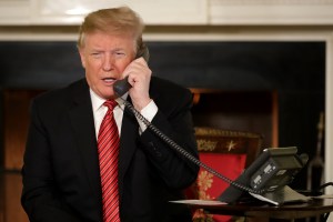 U.S. President Donald Trump takes phone calls in the East Room of the White House December 24, 2018 in Washington, D.C.