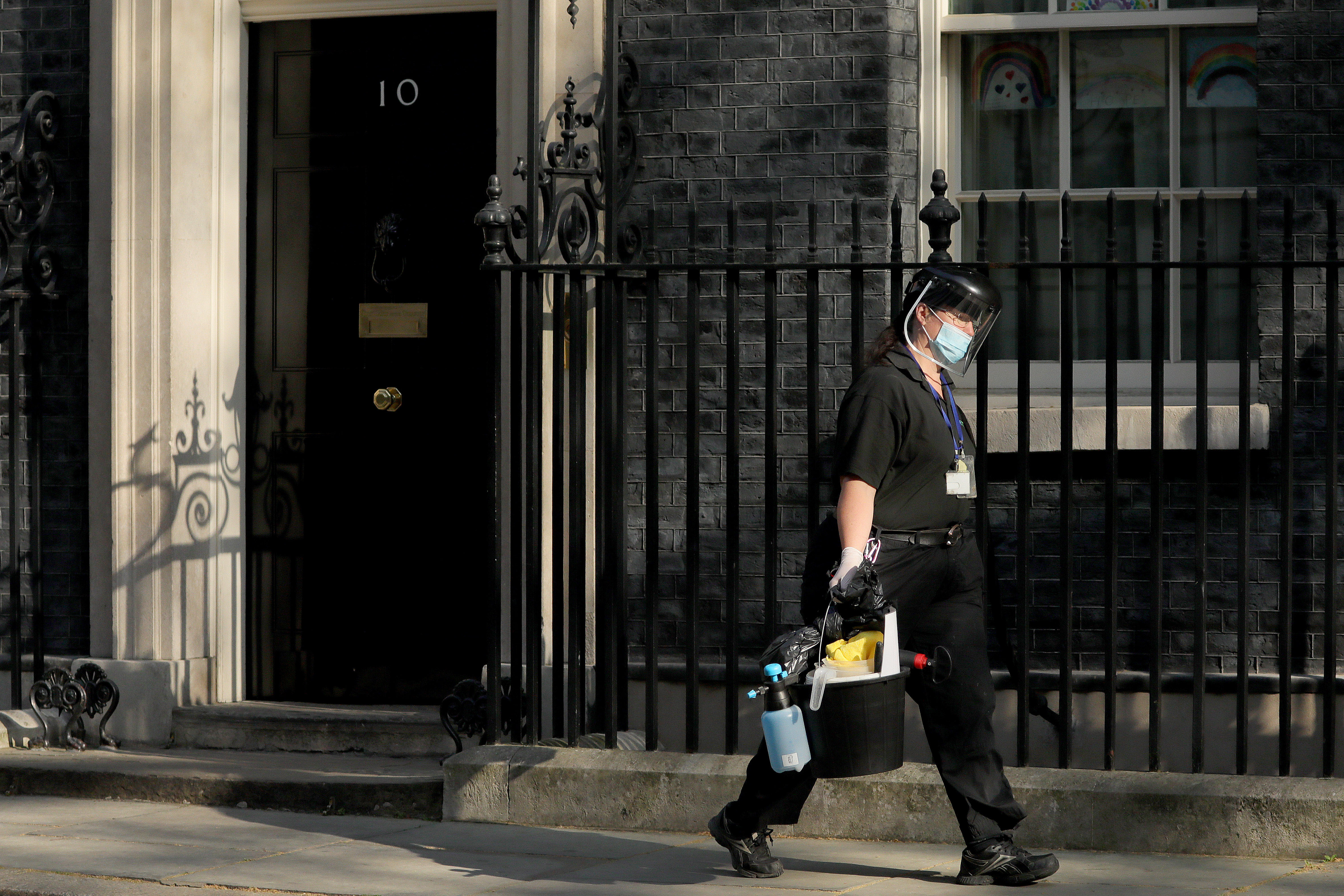 A cleaner leaving Downing Street, London, UK. Photo: Tim Ireland/Xinhua