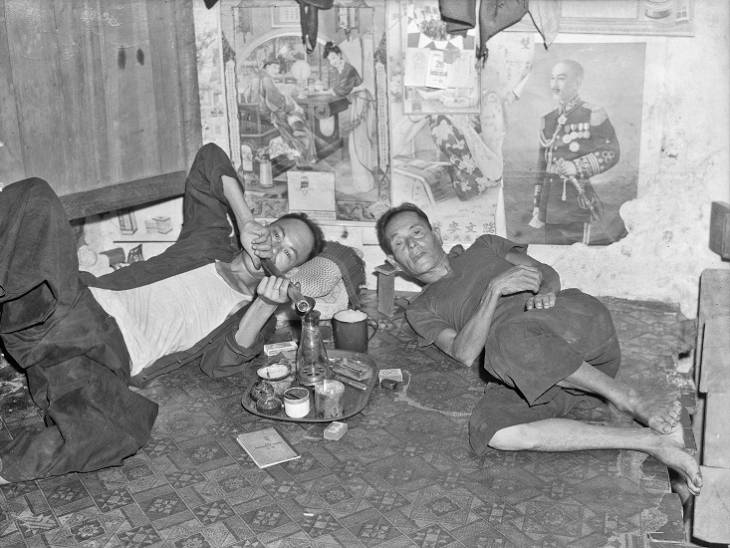 two men in opium den in 1940s or 1950s singapore