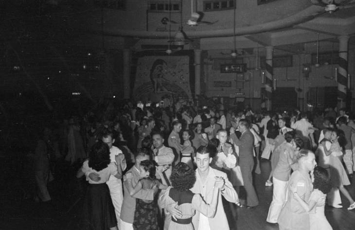men and women dancing in a dance hall in 1940s singapore