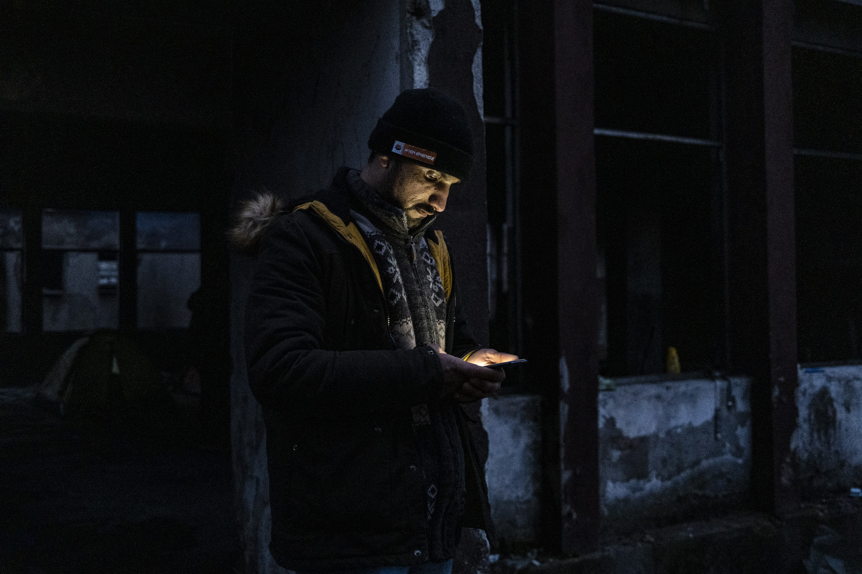 An Afghan refugee outside one of the squats where men like him live in Bihac, Bosnia.