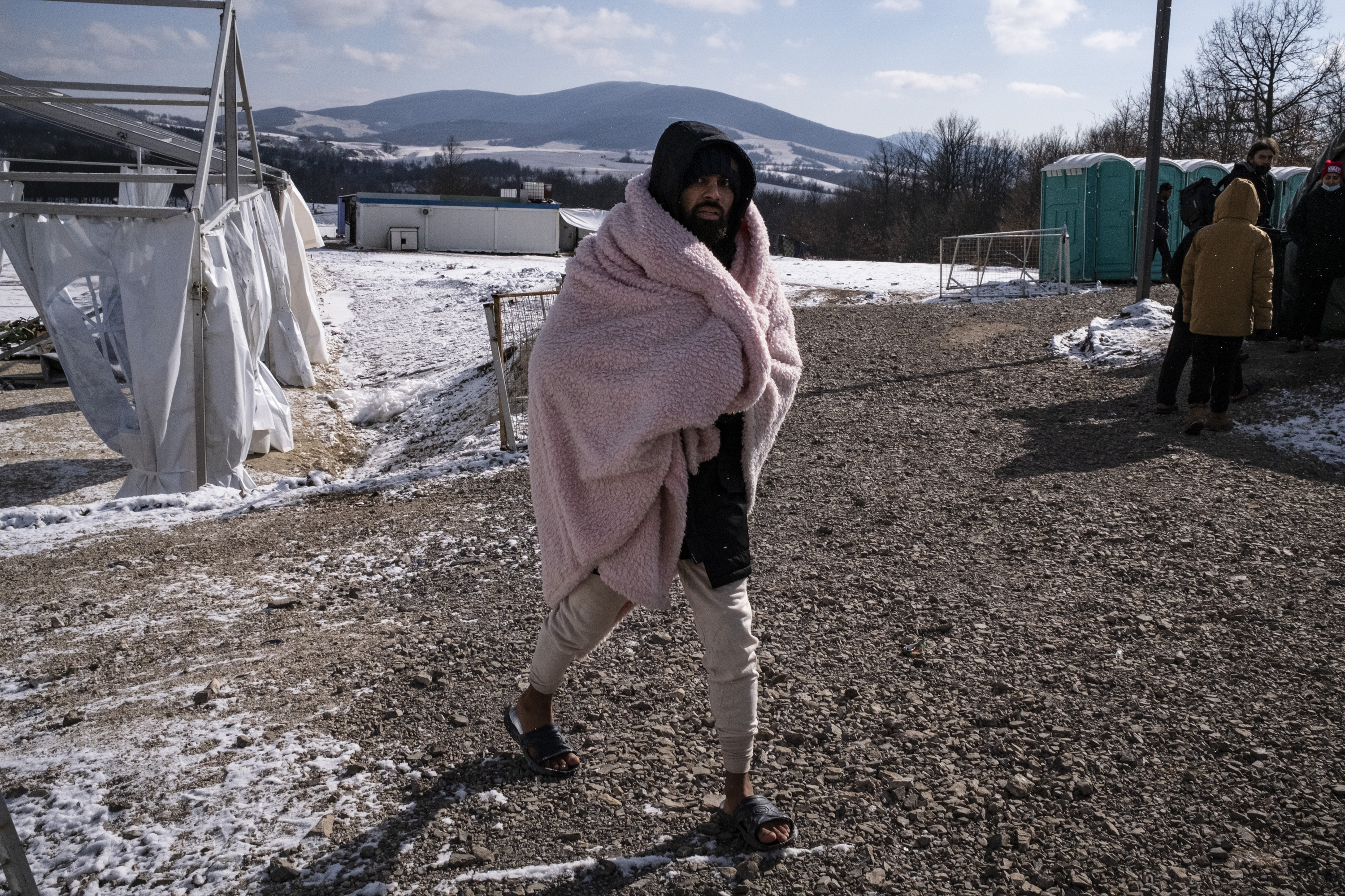 A migrant in the freezing conditions in Lipa camp.