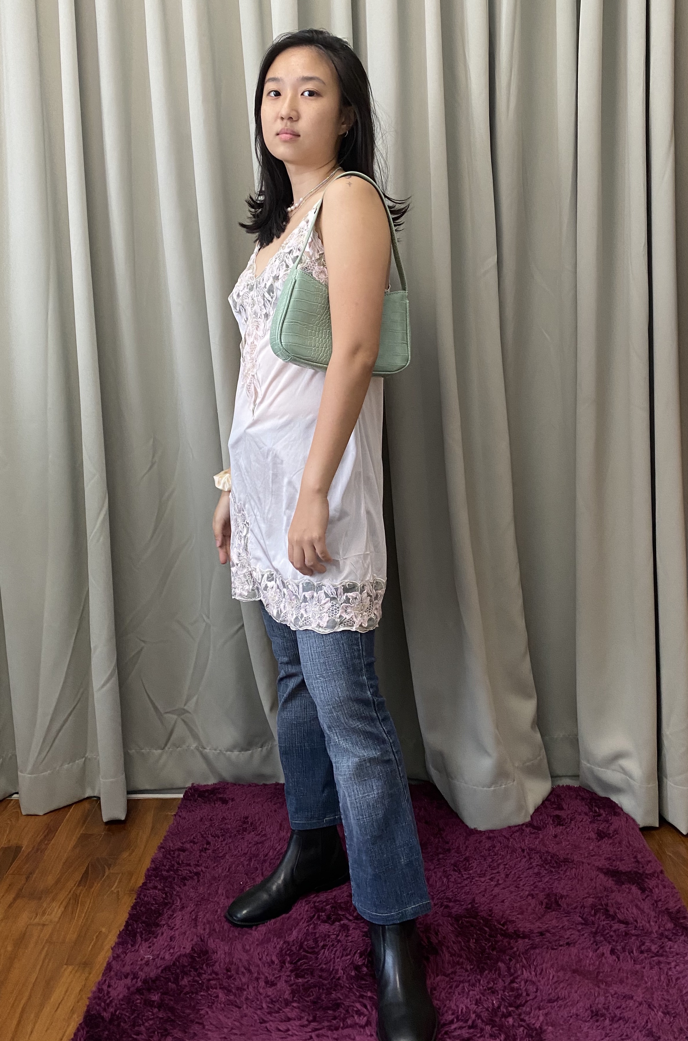 Dress over jeans Y2k 2000s fashion trend.