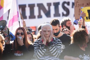 An Israeli protester dressed as Israeli Prime Minister Benjamin Netanyahu in a prisoner costume protests near Jerusalem's district court​.