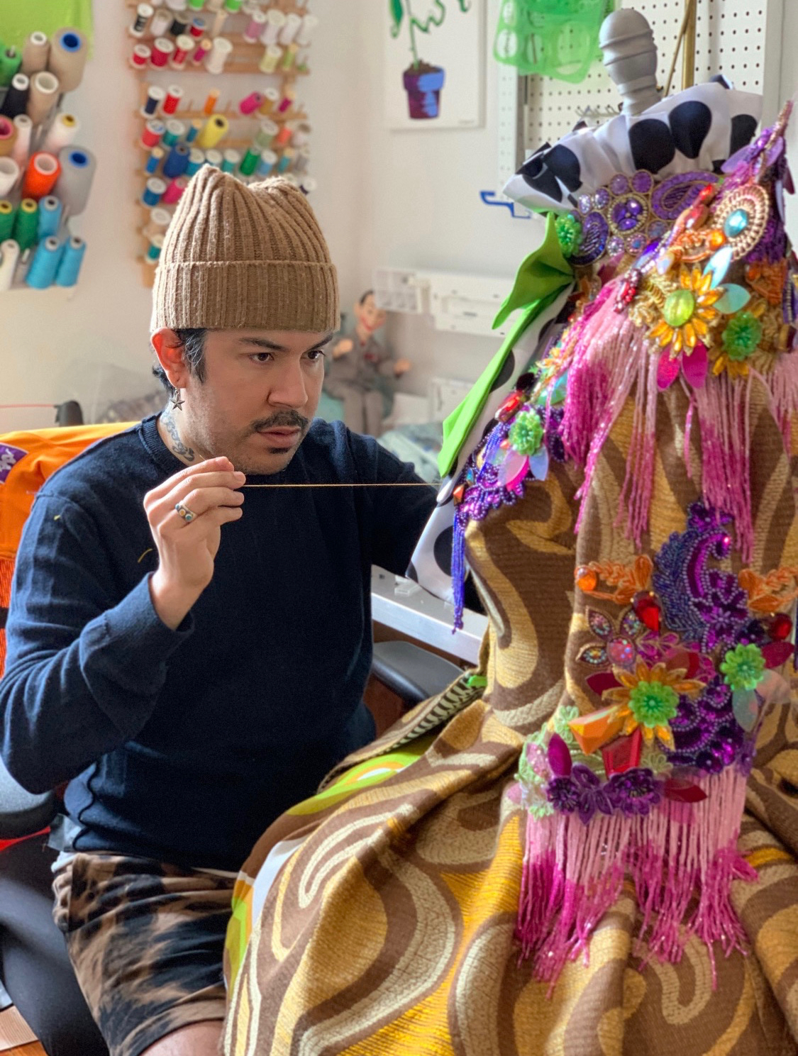 Mondo Guerra works on Crystal Methyd's Drag Race finale look in his studio