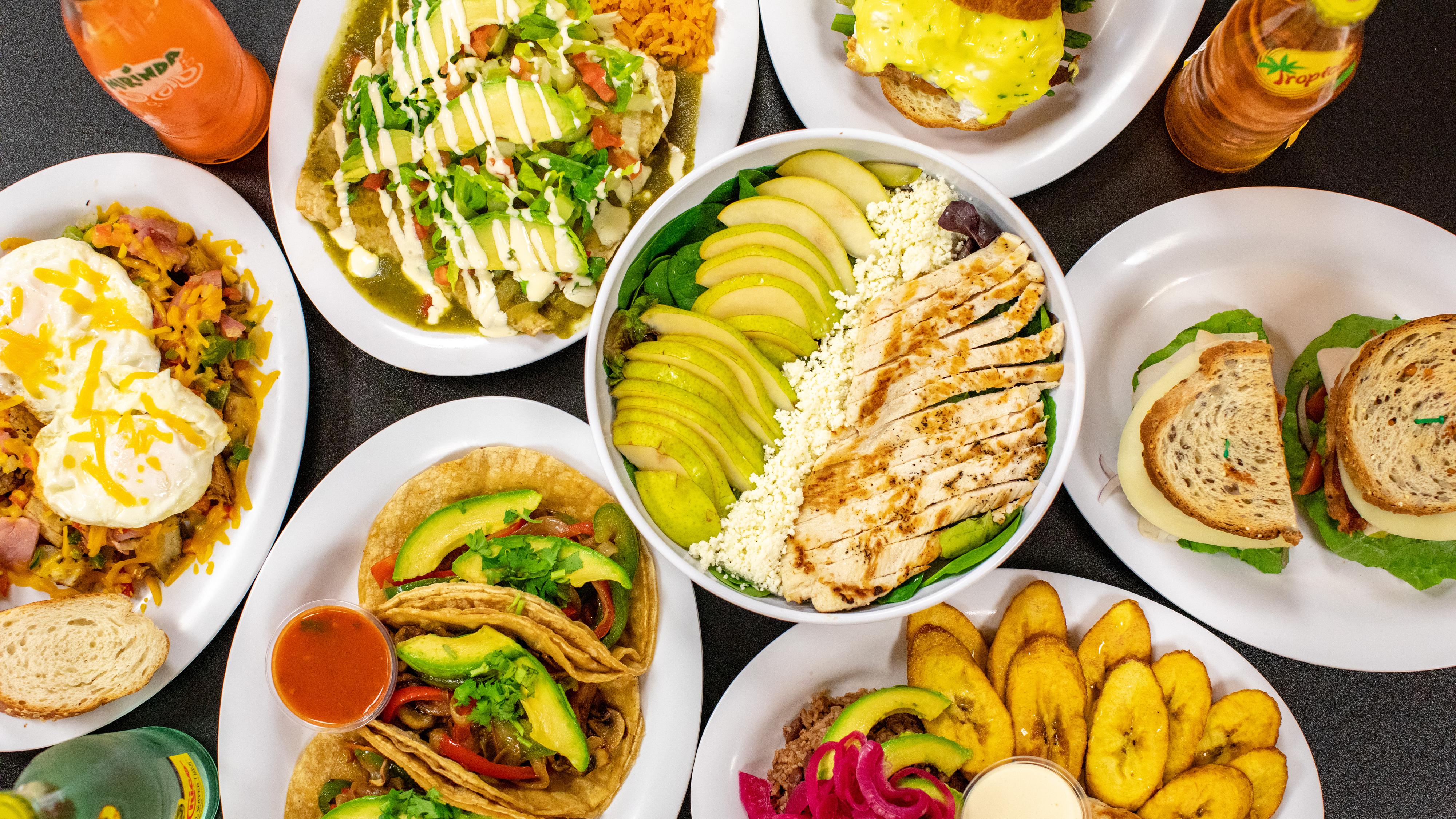 a spread of food including tacos and huevos rancheros from Monona Bakery and Eatery in Monona, Wisconin