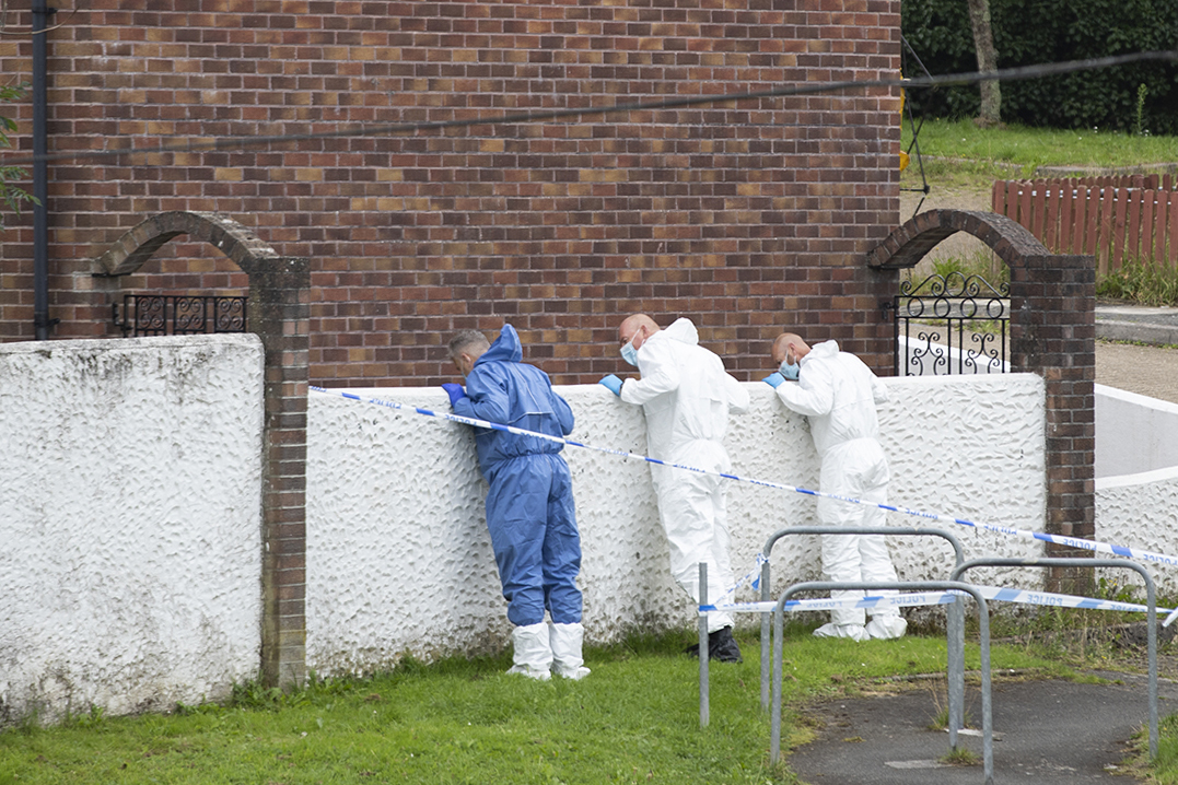 Police teams work near the scene of Thursday's shootings. Photo: William Dax/Getty Images