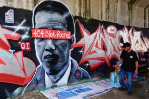 Desainer Kaos Bergambar Mural ‘404:Not Found’ di Tuban Diciduk Polisi