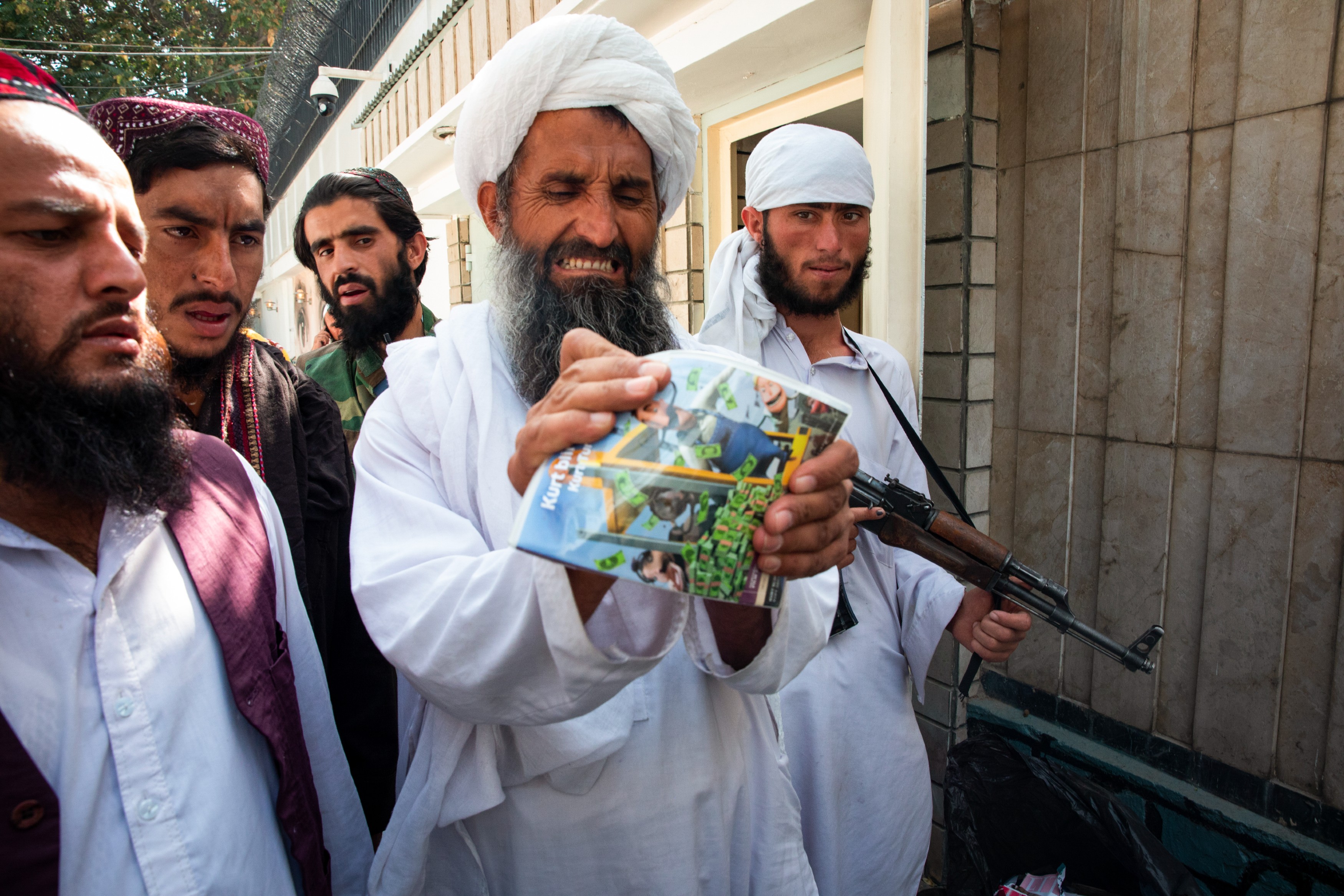 A TALIBAN MEMBER TRIES TO DESTROY A DVD OF THE CHILDREN'S FILM