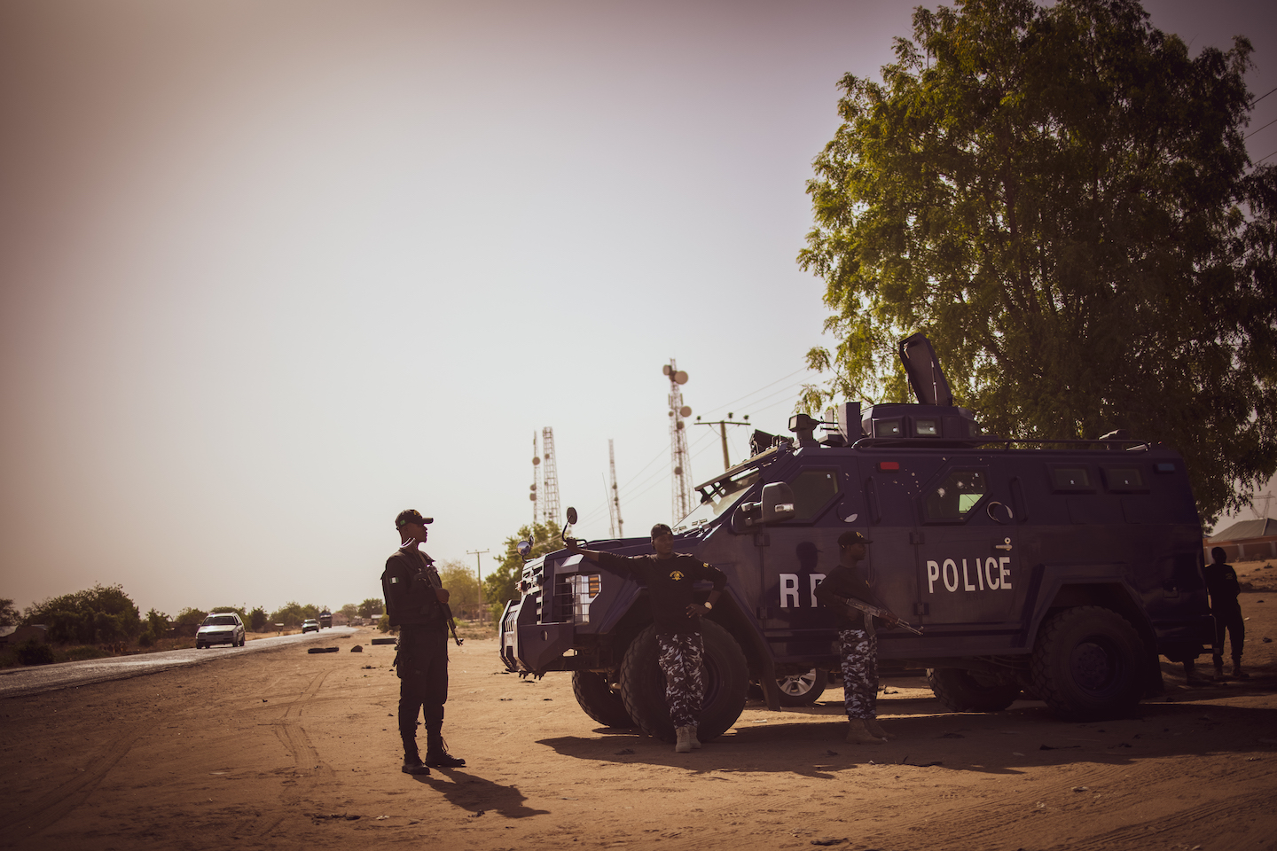 Police officers patrol the area.