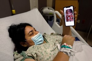 MC ALLEN, TEXAS-July 20, 2020-Mayra Vega, 27, tested COVID positive while she was pregnant and after she delivered July 16 was isolated from her son (Carolyn Cole/Los Angeles Times via Getty Images)​
