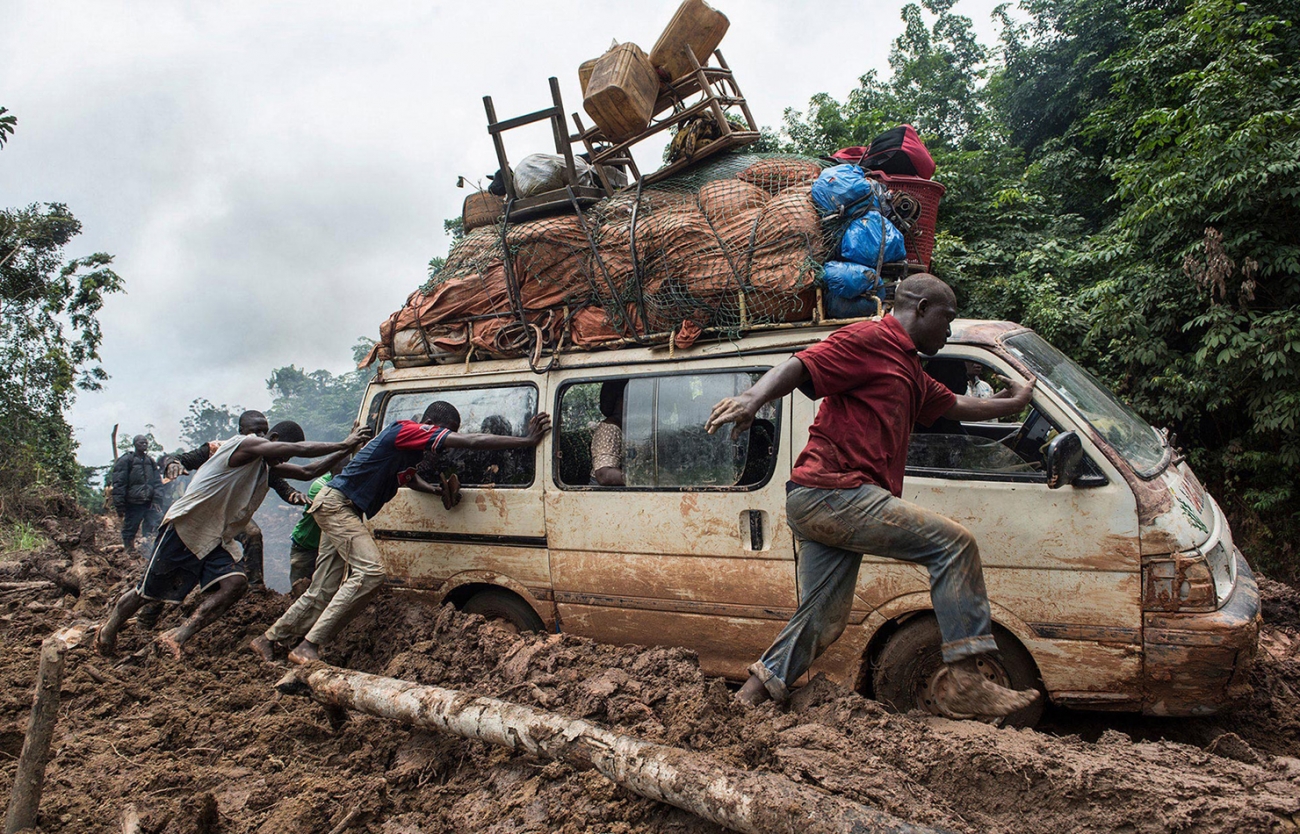 During the rainy season torrential rains degrade the only road that connects Monrovia, to Lofa County. Hundreds get stranded every year making this often vital journey. Many are injured by over turned trucks, or get heat exhaustion or dehydration. Photo: Hannah Maule-ffinch