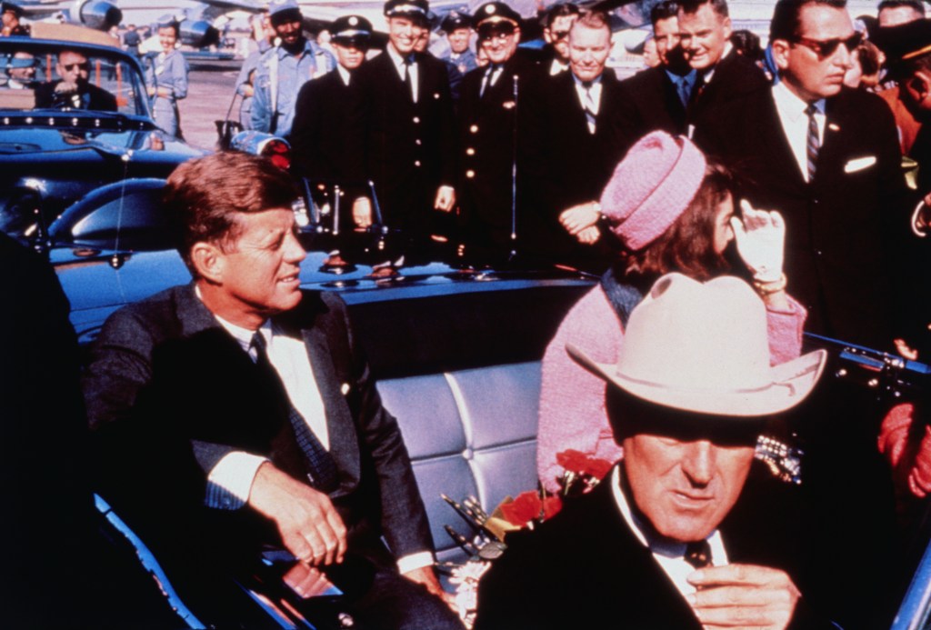 Texas Governor John Connally with President and Mrs. Kennedy prepared for motorcade into Dallas from airport, Nov. 22 (Getty Images).