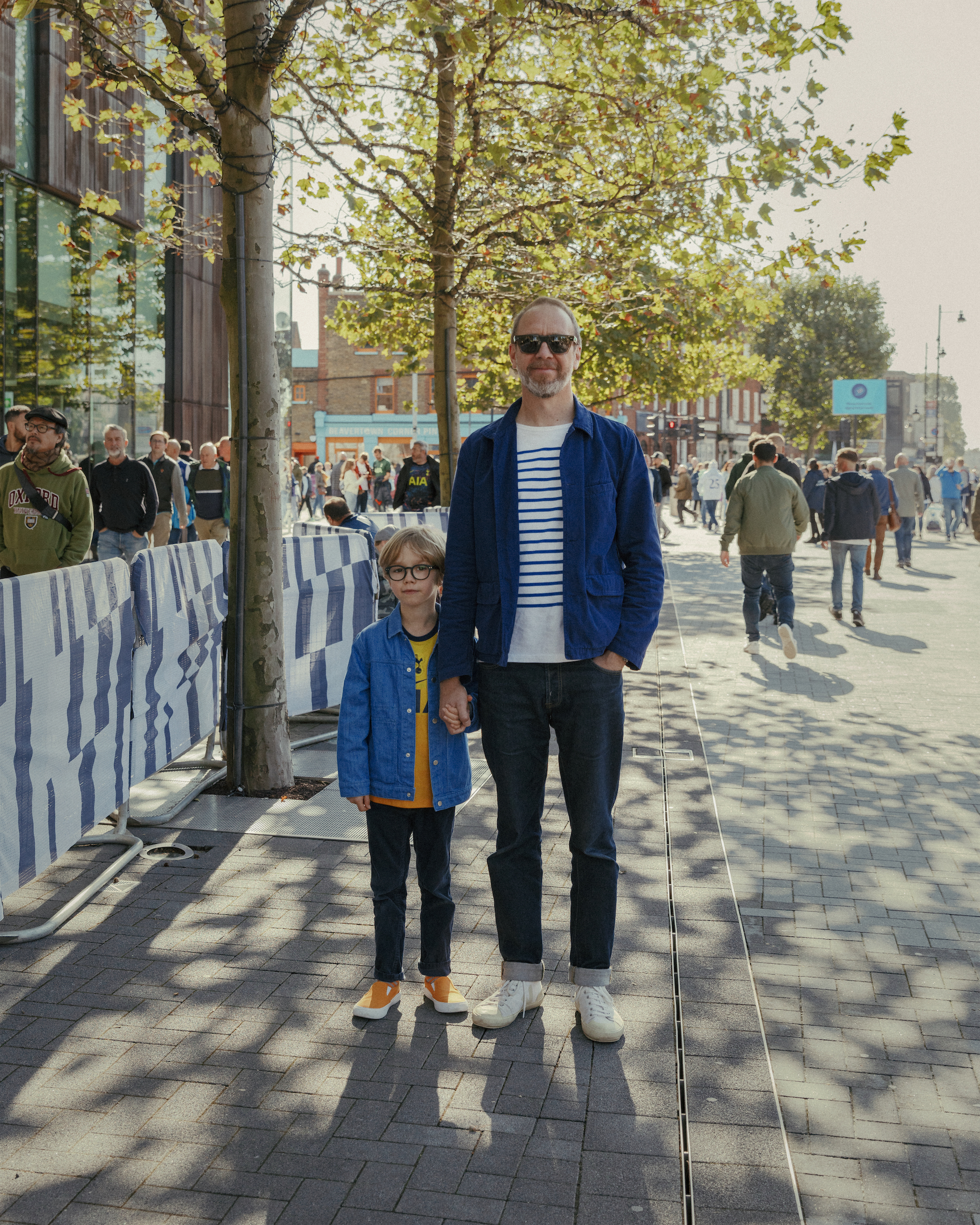 Ben Gilbert (right) holds hands with his son, Indigo.
