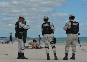 Members of the National Guard (Guardia Nacional de México) patrol Playa Pescadores in Tulum following a surge in killings at the local resort tied to the local drug trade and political changes.