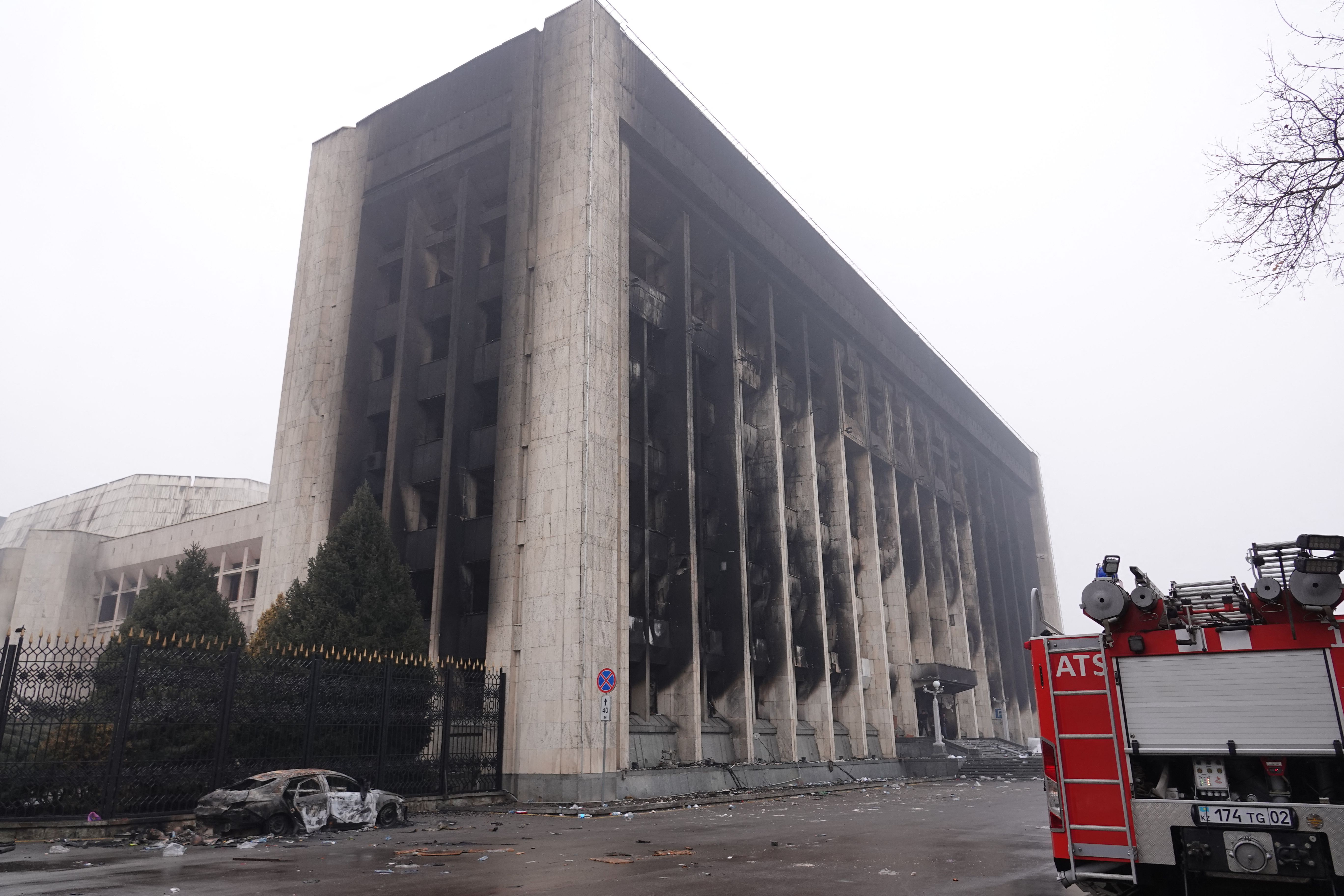 A burnt-out administrative building in central Almaty on Friday. Photo: ABDUAZIZ MADYAROV/AFP via Getty Images