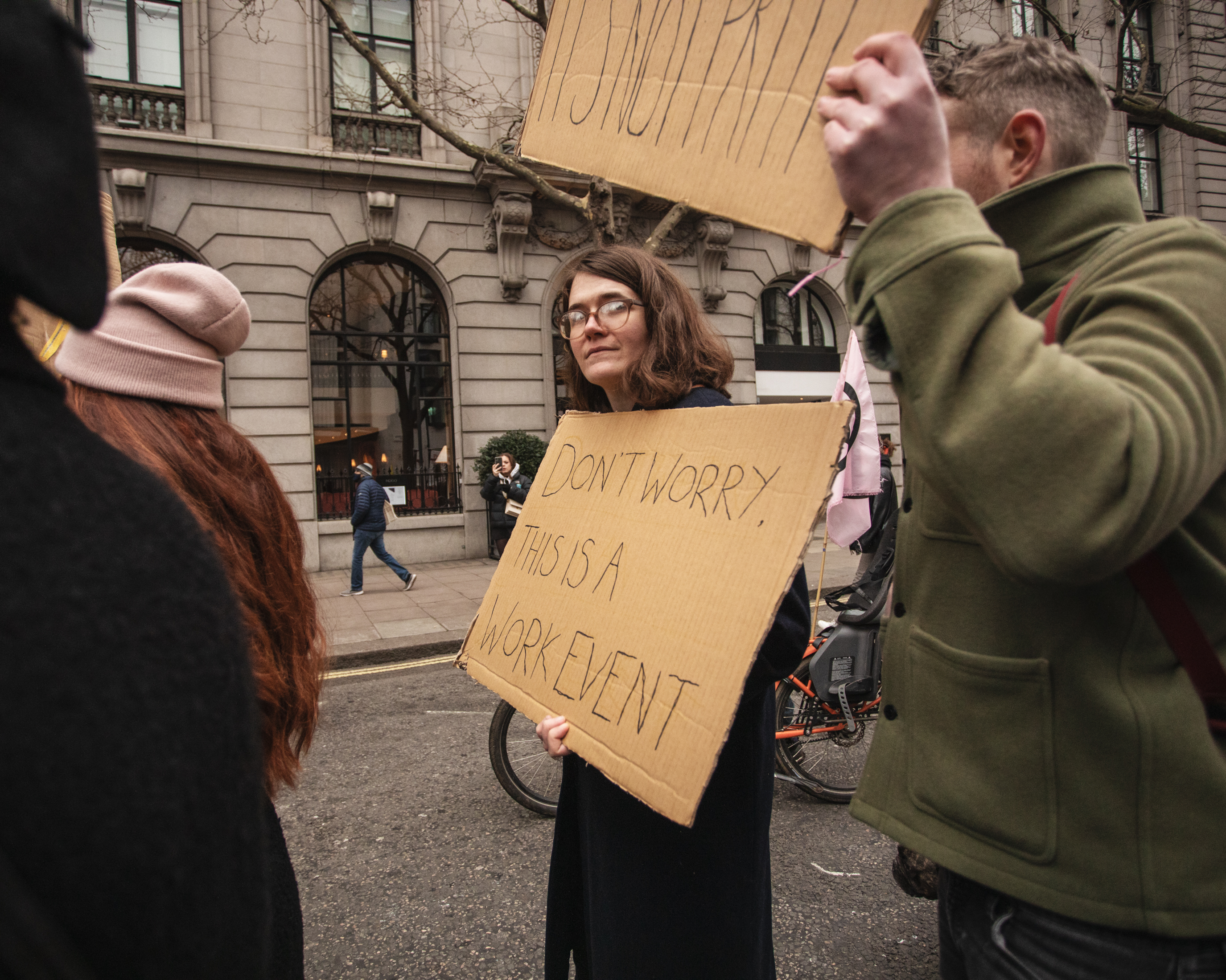 A Kill the Bill protester carrying a sign that says