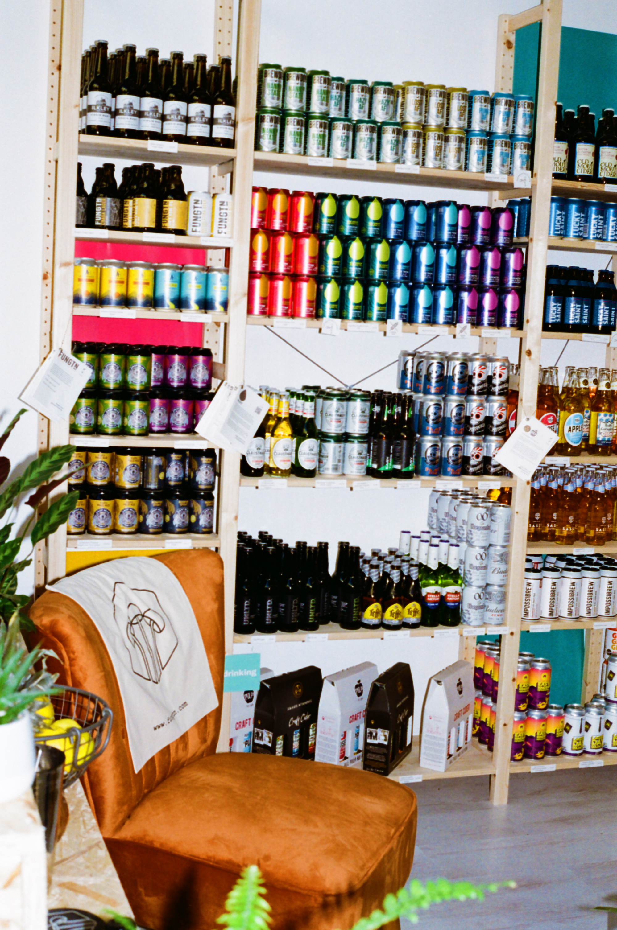 A chair next to a shelf of non-alcoholic booze at The Offy, Soho, London