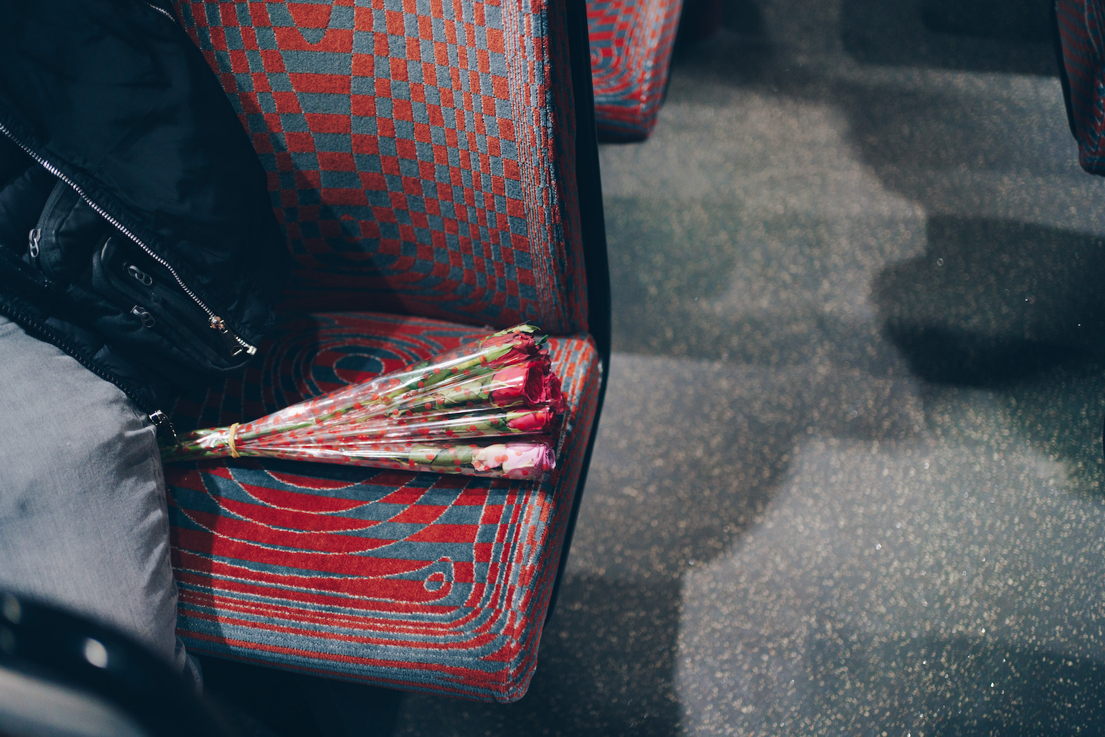 A bouquet of roses on the night bus in London