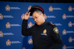 Ottawa Police Chief Peter Sloly takes off hat as he arrives to speak at a news conference on updated enforcement measures as a protest against COVID-19 restrictions continues into its second week, in Ottawa, on Friday, Feb. 4, 2022. THE CANADIAN PRESS/Jus