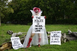 Still from Mythical Creatures about the Argaman Alliance by Liad Hussein Kantorowicz, of a woman holding up a sex workers rights sign