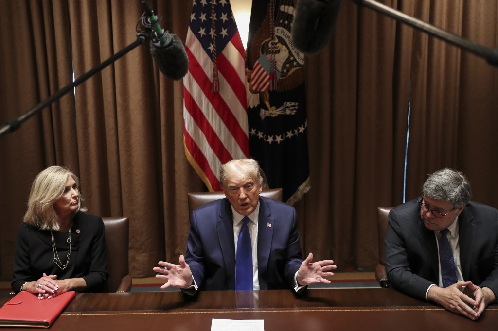 Former President Donald Trump speaks next to William Barr, former U.S. attorney general at the White House in Washington, D.C. on Sept. 23, 2020.​