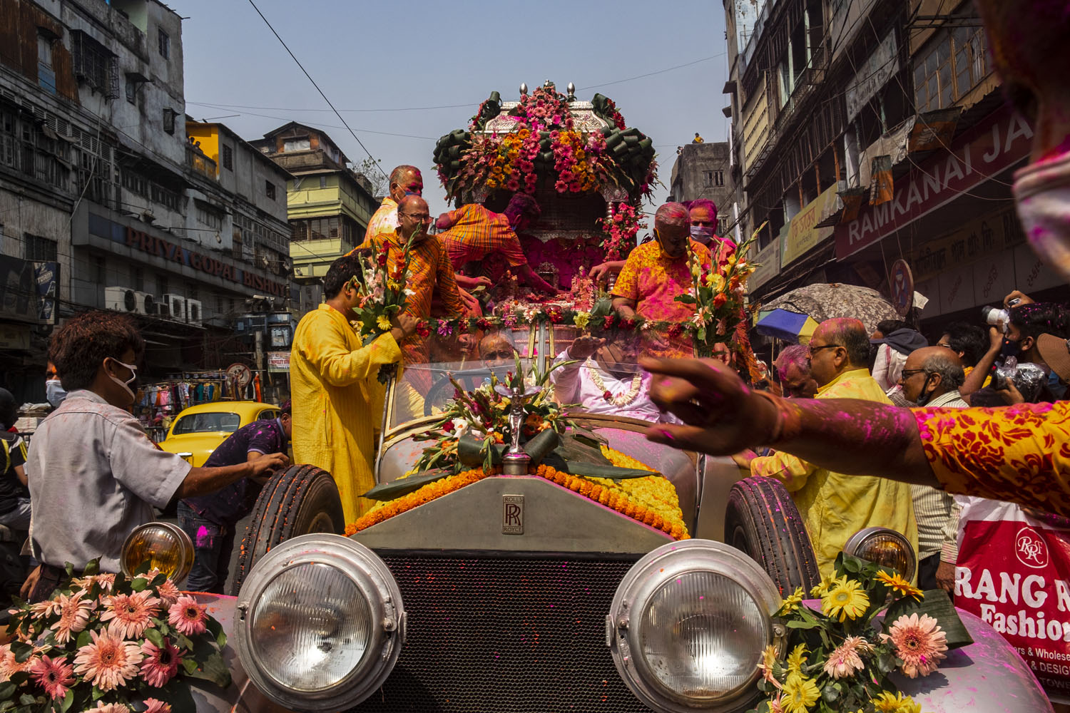 Holi celebration in Kolkata, India, inside a Rolls Royce car