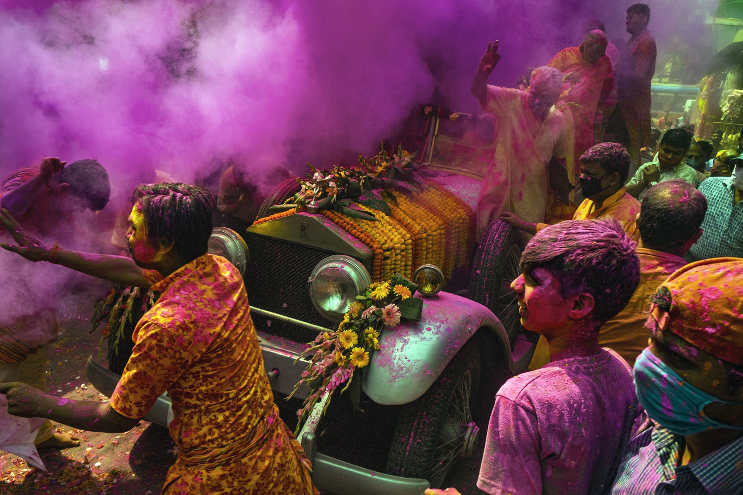 Holi celebration in Kolkata, India, inside a Rolls Royce car