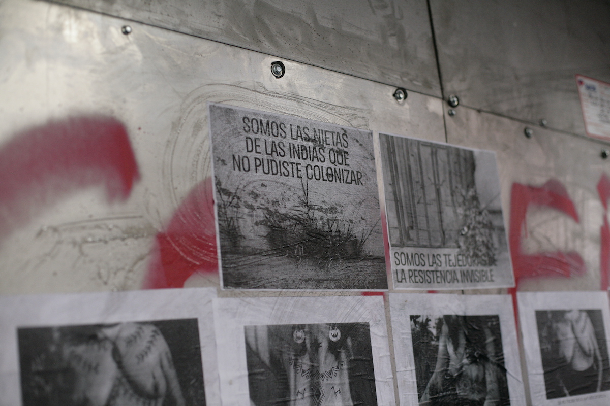 Chile protests – black and white posters by indigenous women's collectives. Four show women's topless bodies, one reads