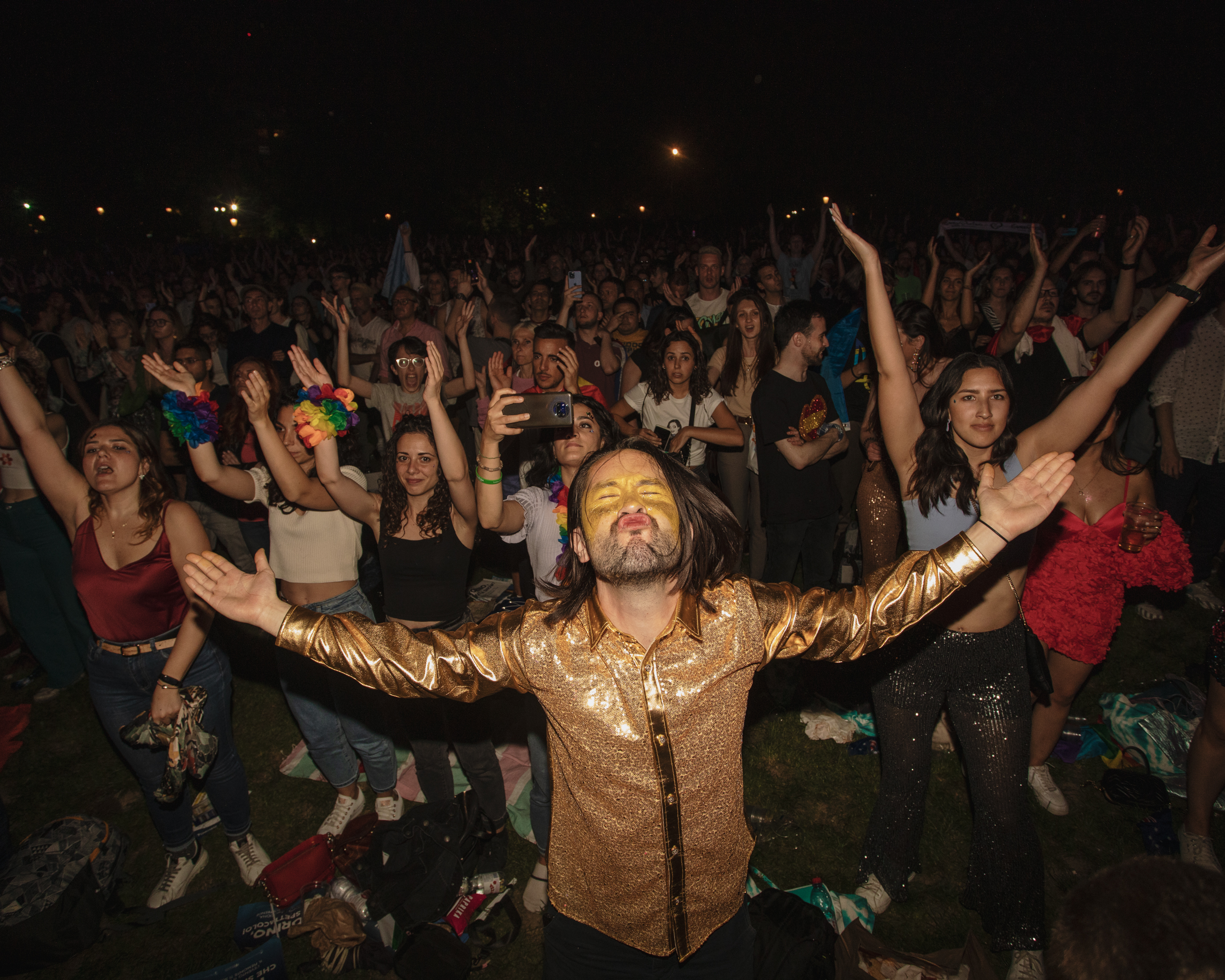 Eurovision 2022 in Turin, Italy: A man in gold face paint celebrating