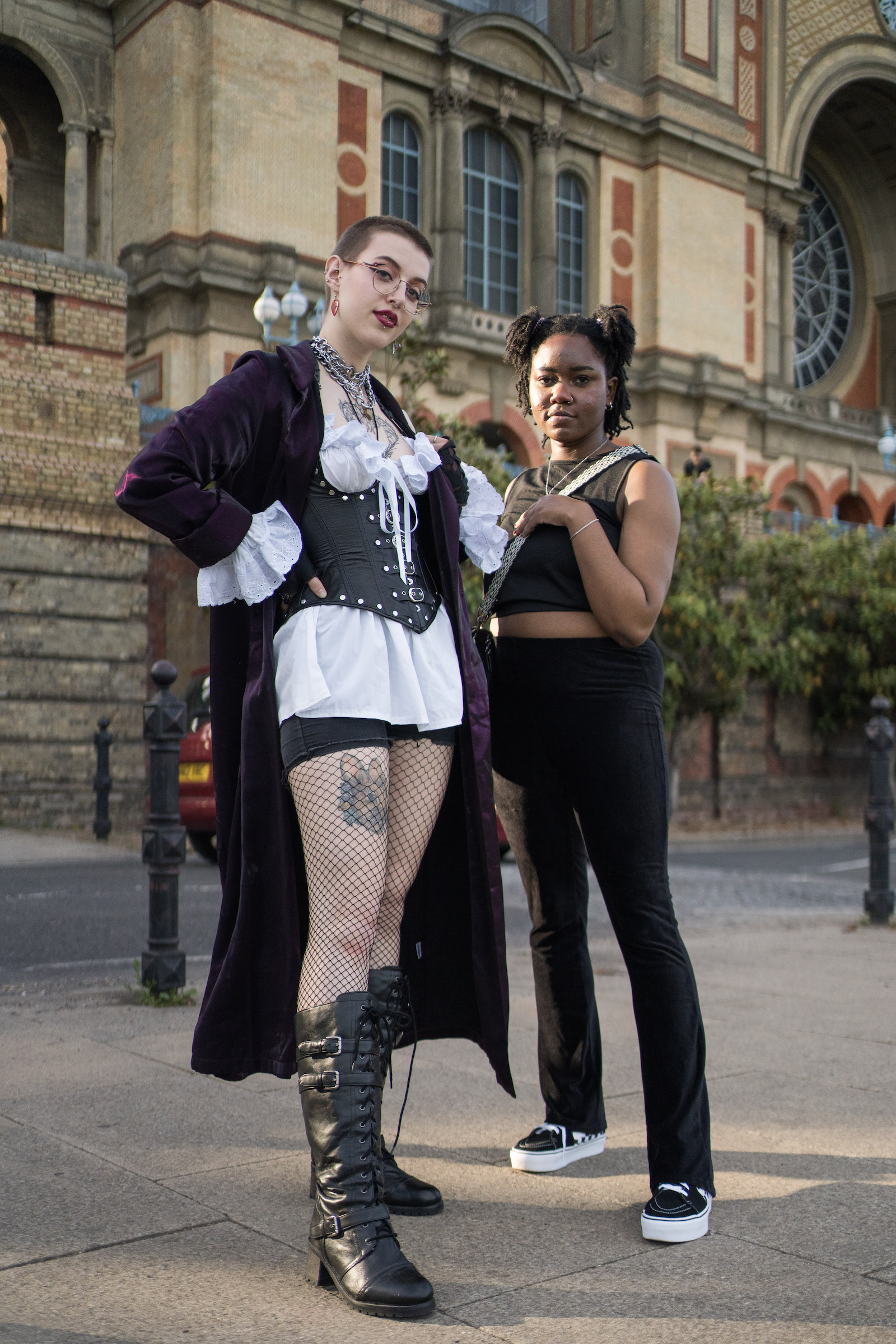 Two Charli XCX fans at Alexandra Palace, London, one in a corset and one in black
