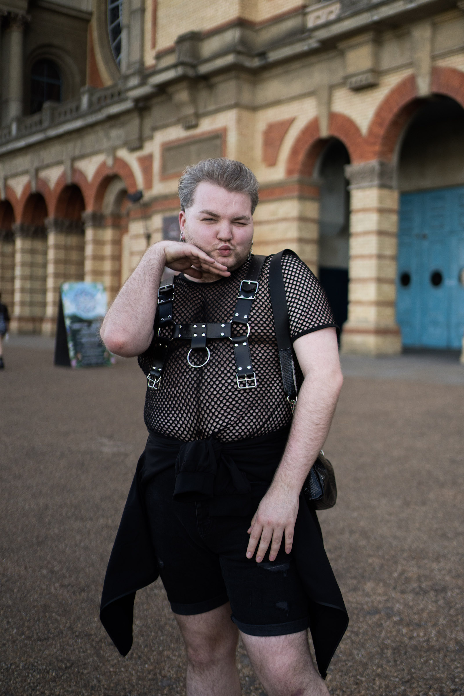 A Charli XCX fan at Alexandra Palace, London, dressed in black fishnet