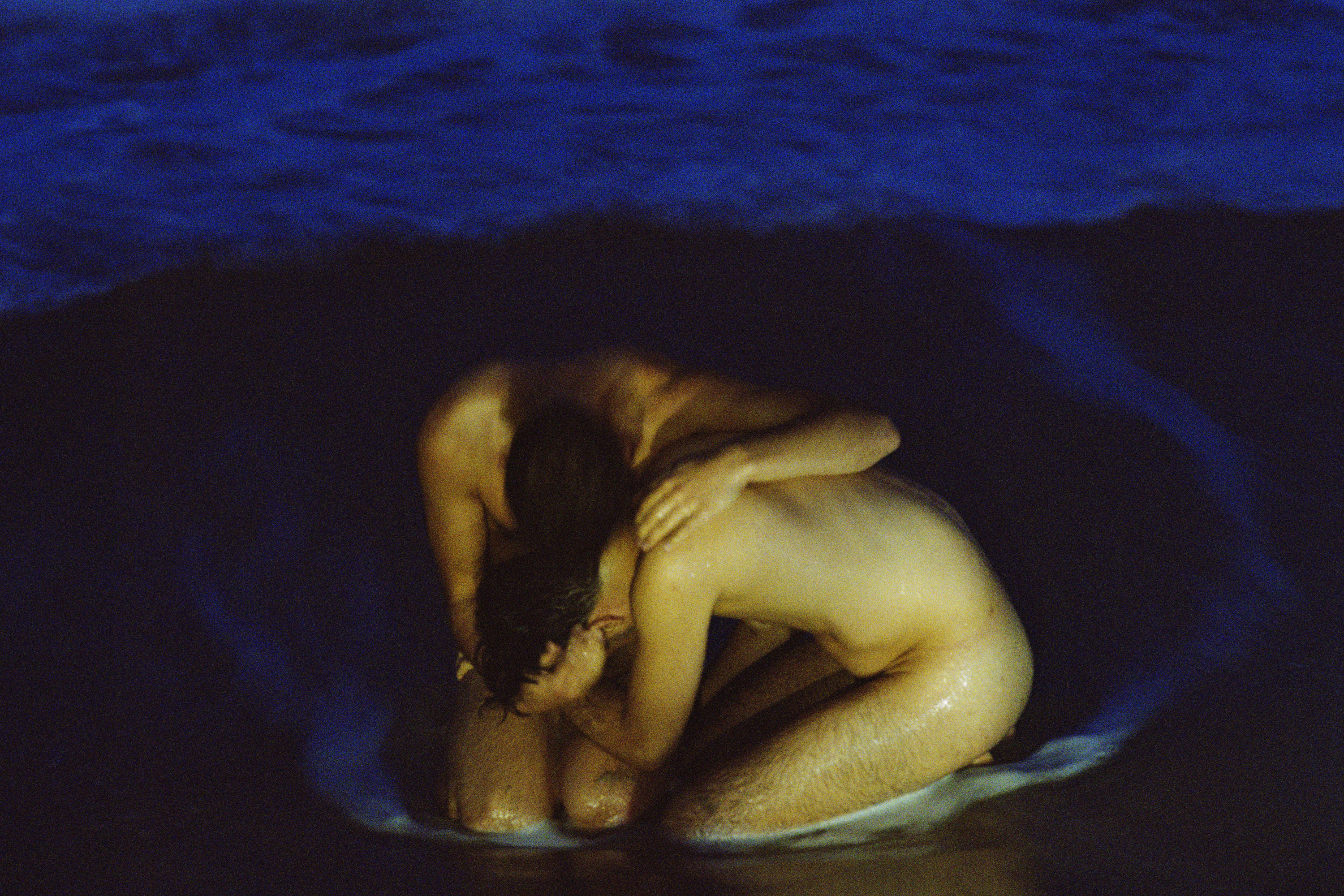 Fire Island: Two gay men embrace naked on the beach, photography by Matthew Leifheit from To Die Alive