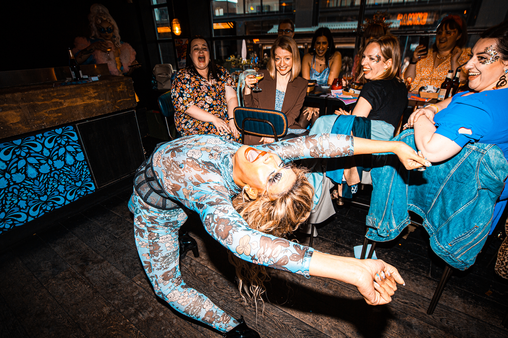Drag queen Soroya Marchelle doing a backbend at Queen of Hoxton drag brunch