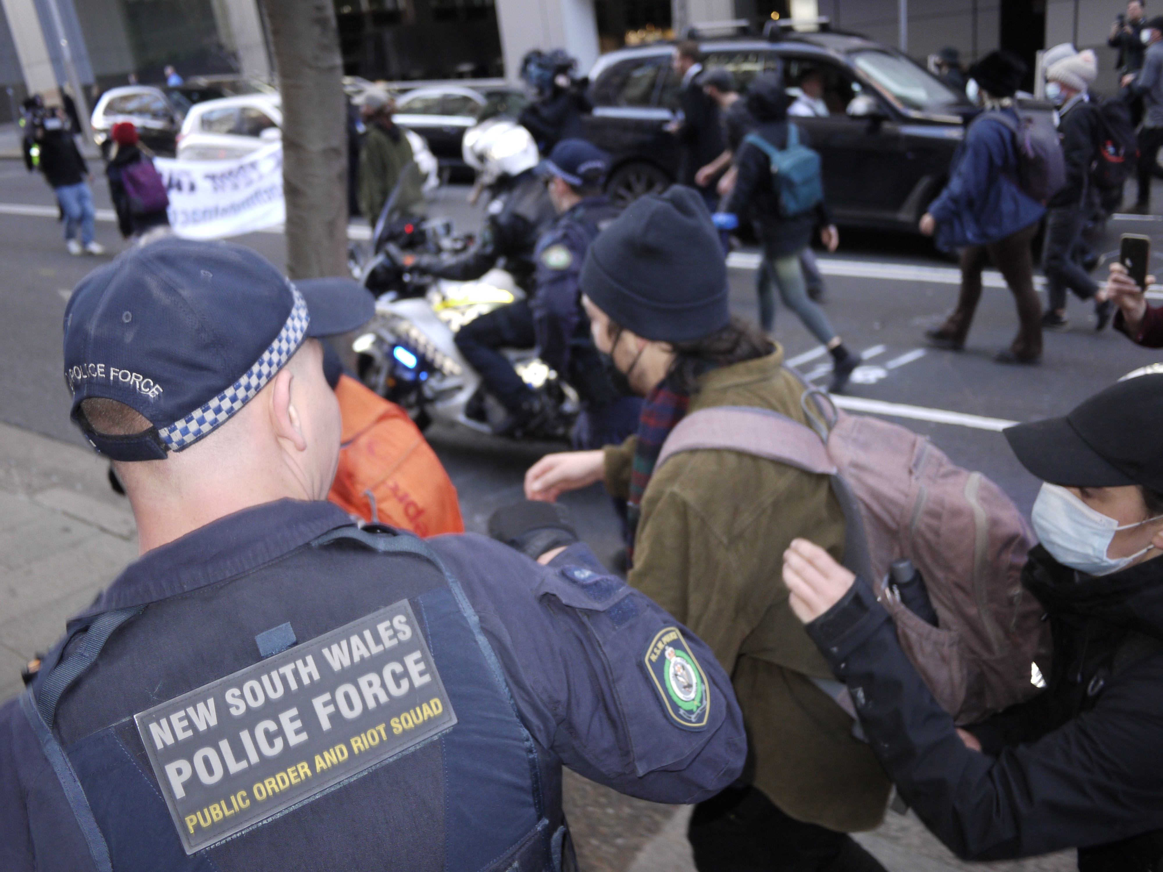 NSW Police riot squad handle a Blockade Australia activist in Sydney. Photo by John Buckley / VICE
