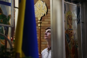 A man looking up at a cross