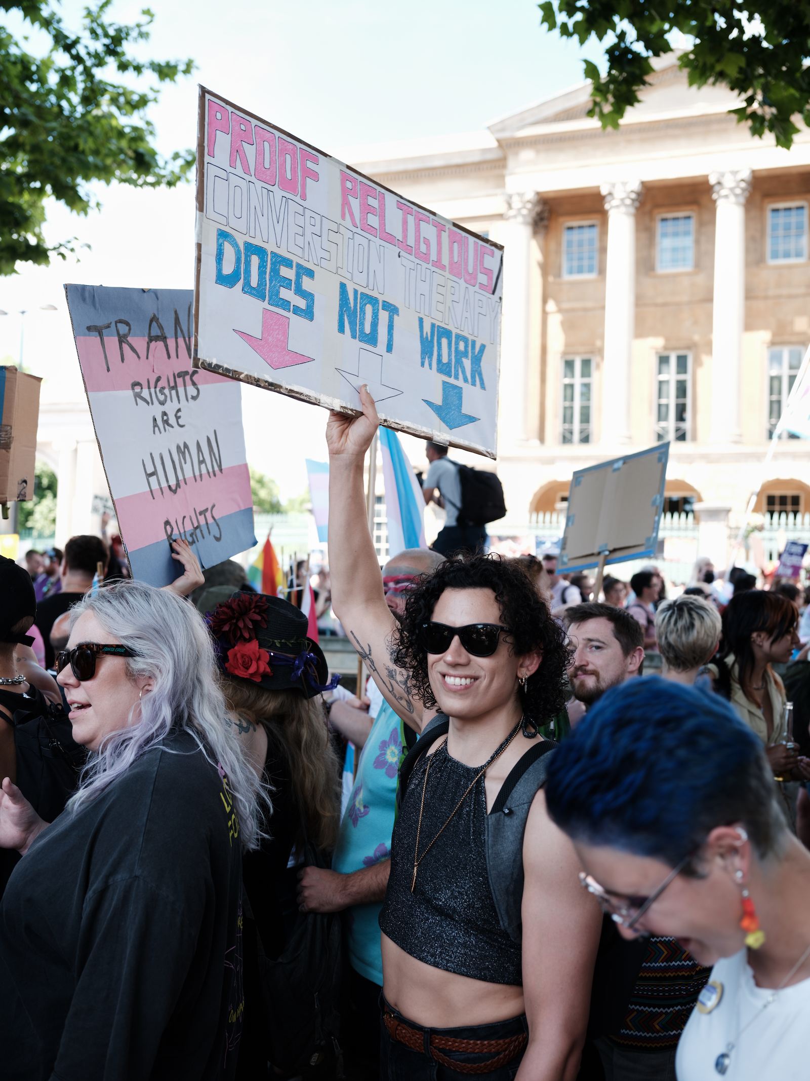 A protester holding a sign at London Trans+ Pride 2022