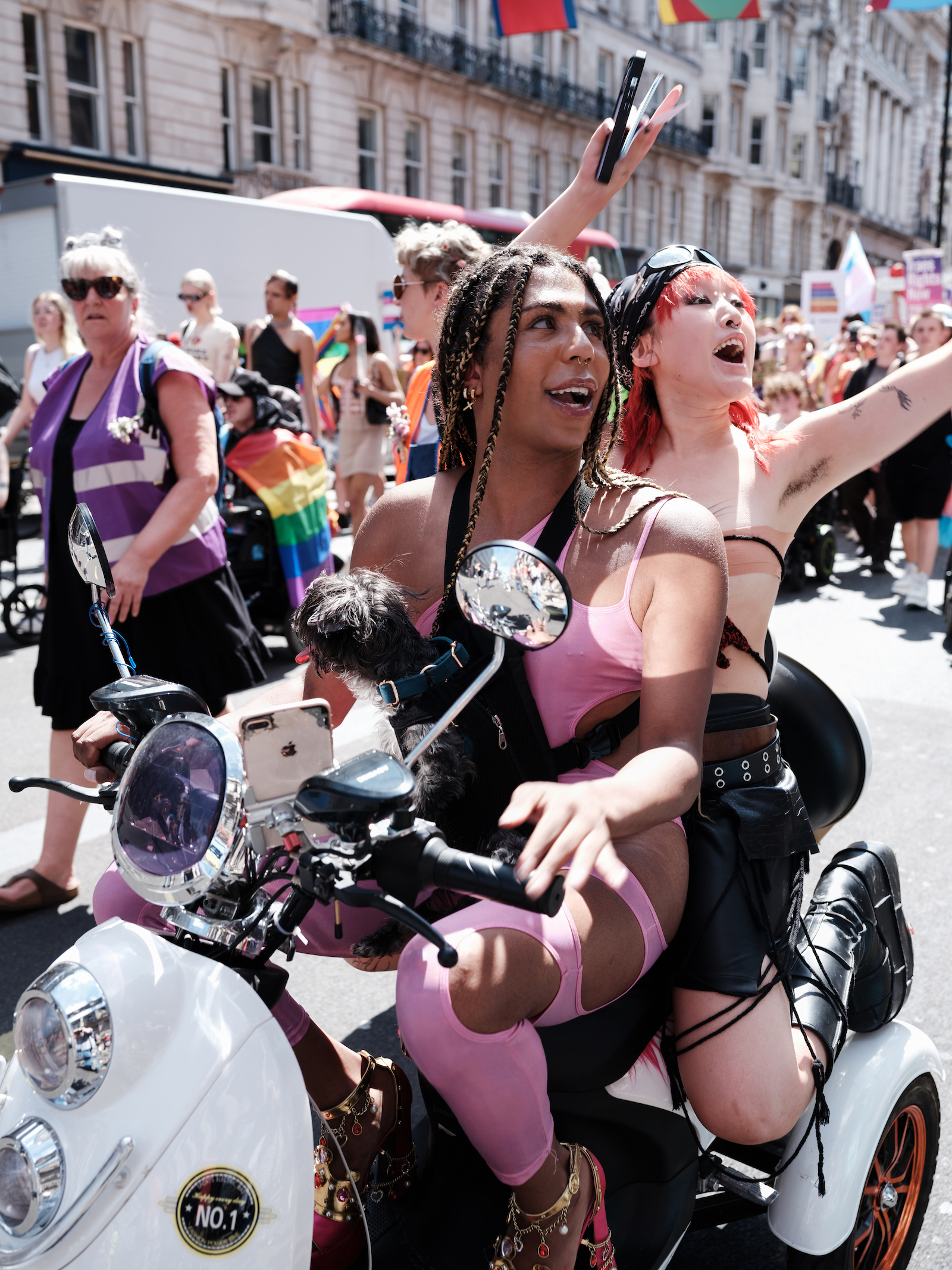 Protesters riding a bike at London Trans+ Pride 2022