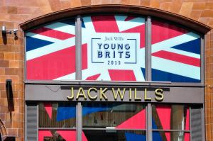 The Jack Wills shop front in 2015, with a British flag