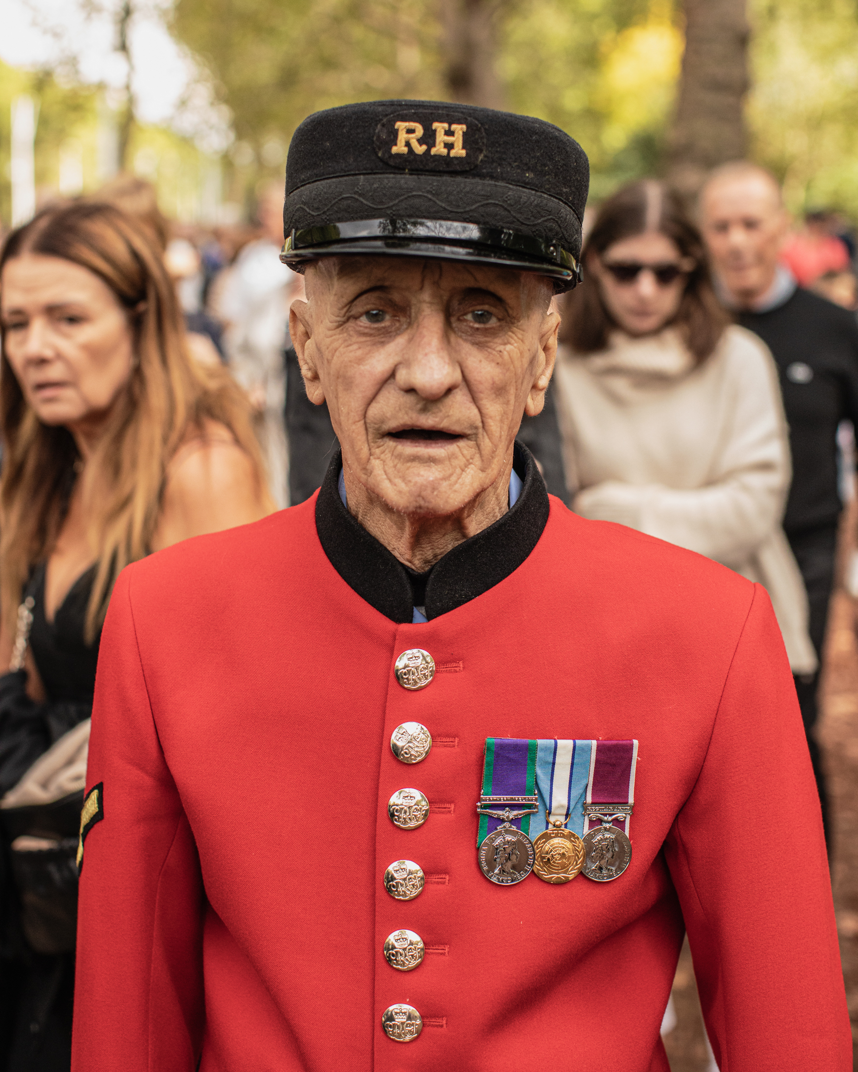 A man with multiple medals in St James's Park.
