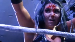 A wrestler with a bloodied forehead