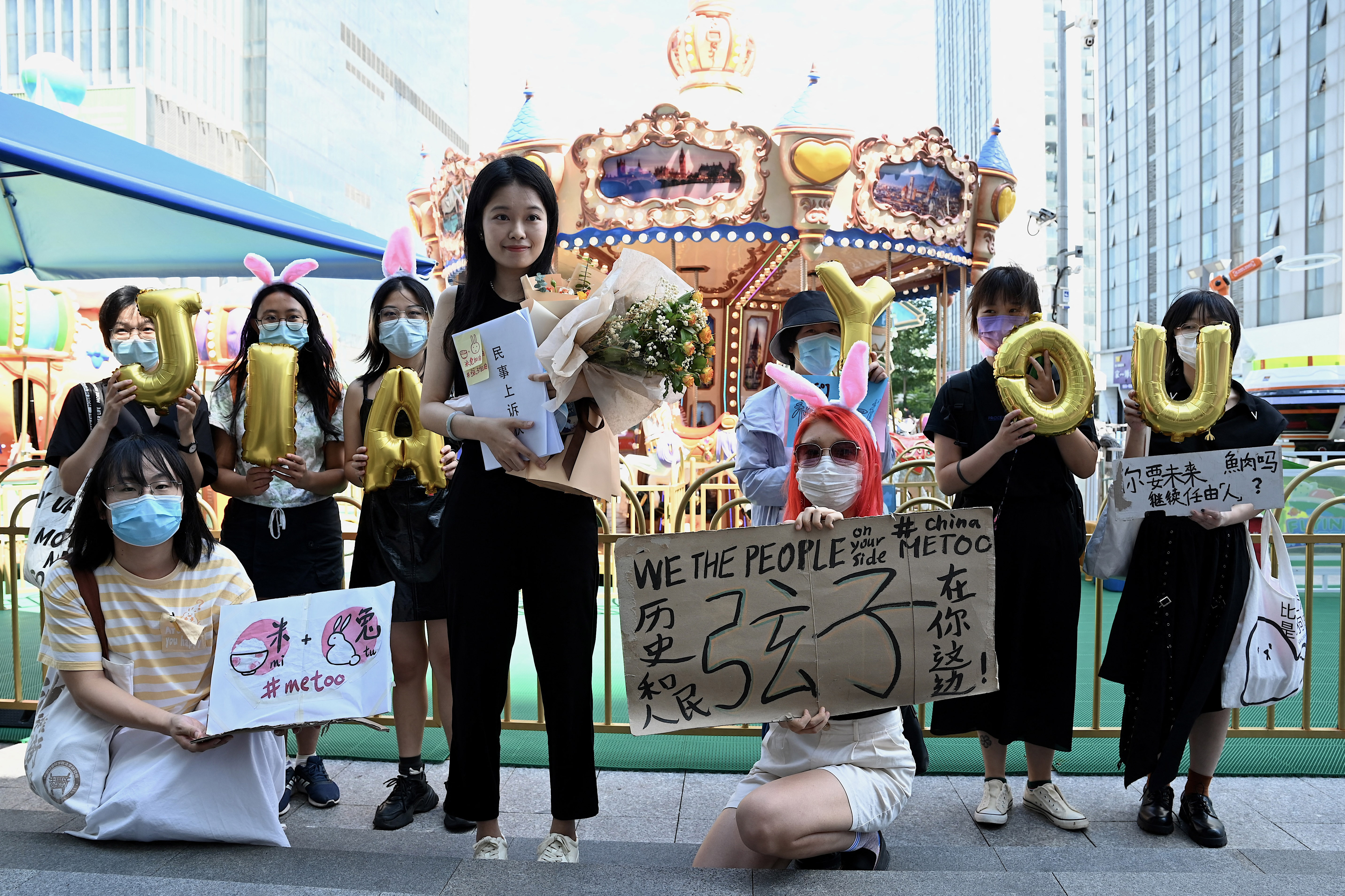 CHINA'S #METOO ICON XIANZI WITH HER SUPPORTERS BEFORE A HEARING. Photo: NOEL CELIS/AFP