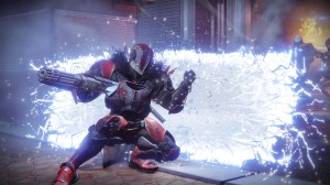 A titan from Destiny 2 slams through a wall of energy shoulder first.